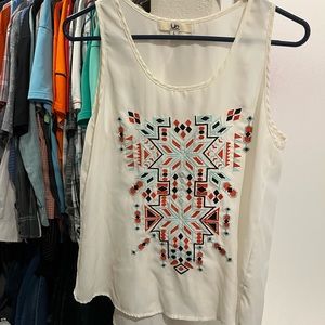 Sleeveless cream tunic